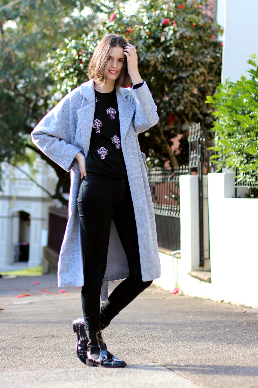 BY CHILL Chloe Hill Wearing Lonely Hearts grey duster coat and Sportmax code embellished sweatshirt