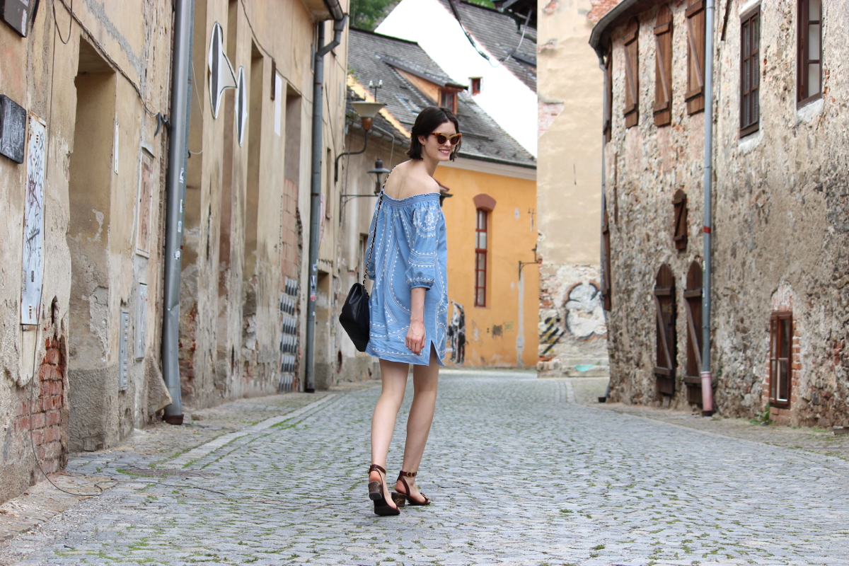 BY CHILL Chloe Hill wearing Seed Off the Shoulder Dress on the Streets of Cesky Krumlov in the Czech Republic