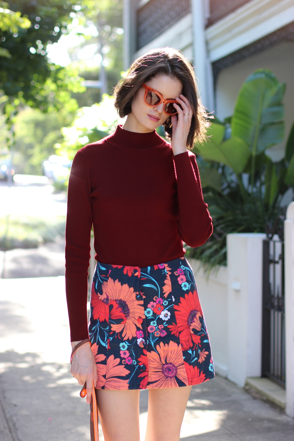 BY CHILL BLOG | Chloe Hill Wearing Pared Eyewear orange puss and boots sunglasses, Cue clothing burgundy jumper and top shop floral print sixties mini skirt