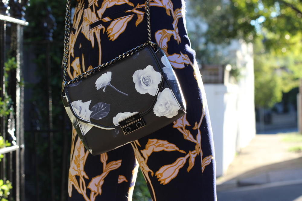 BYCHILL | Alila flower print leather shoulder bag and karen walker flared trousers on teh streets of sydney
